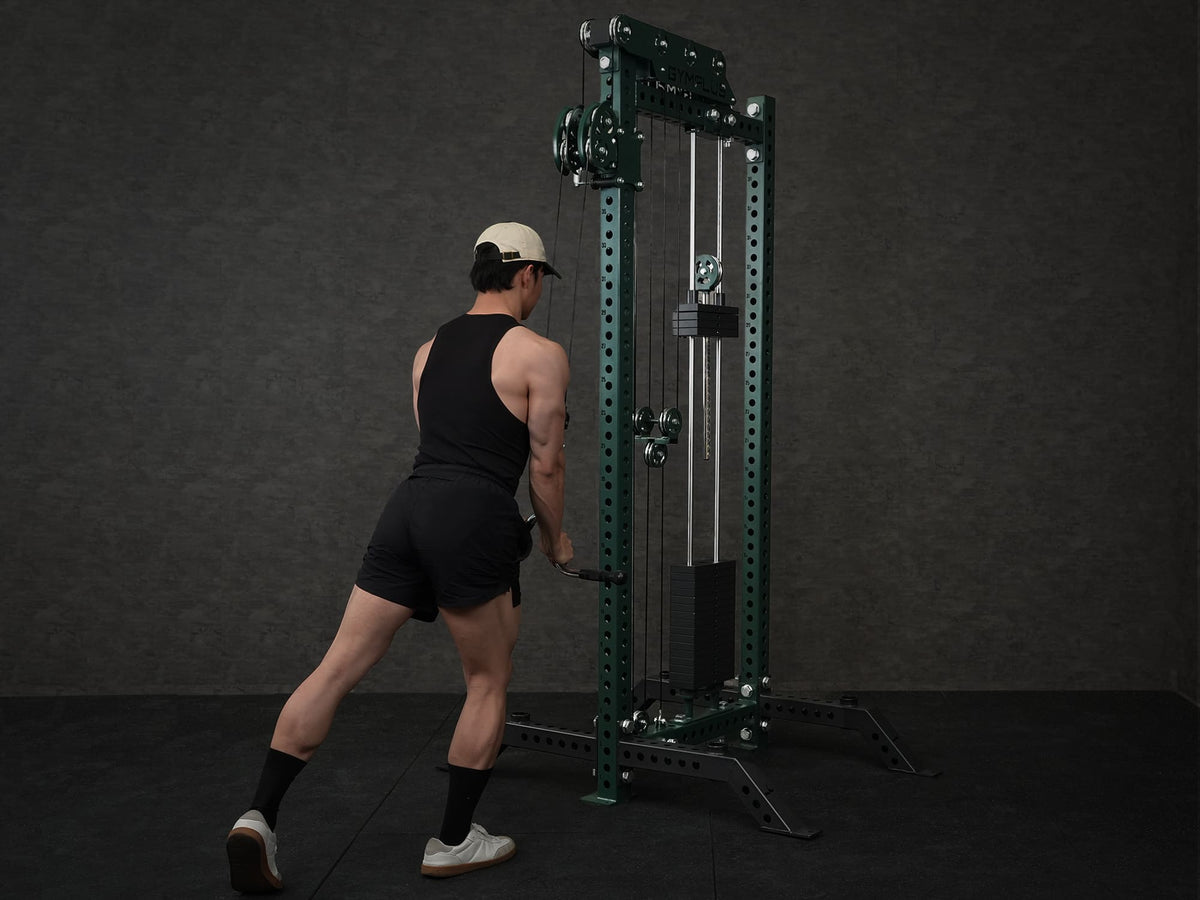 Gym Plus Extended Tricep Bar Cable Attachment with Rubber Grips TRICEP-BAR a man is performing pull down using the cable attachment