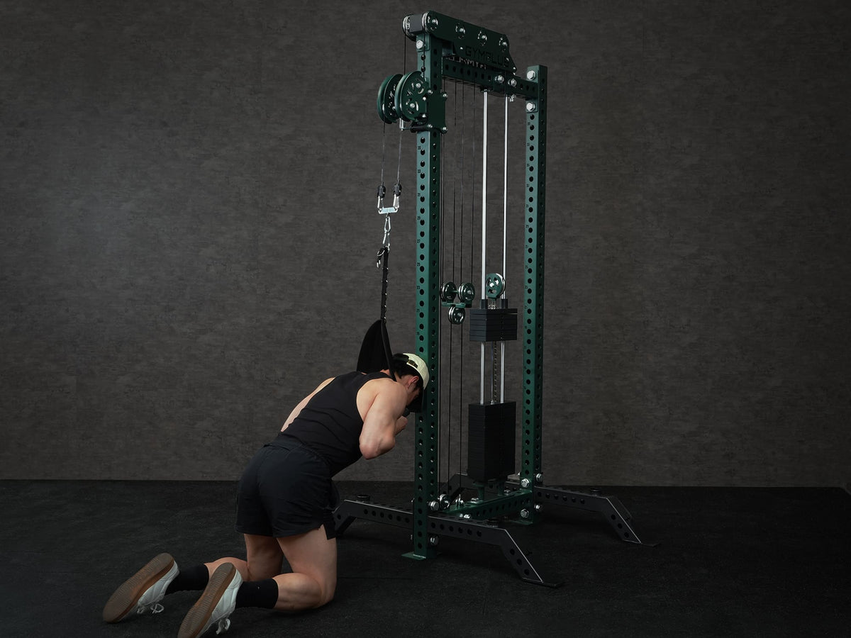 Gym Plus Ab Crunch Harness Cable Attachment CABLE-CRUNCH a man is performing ab crunch in front of Evolve Cable Tower