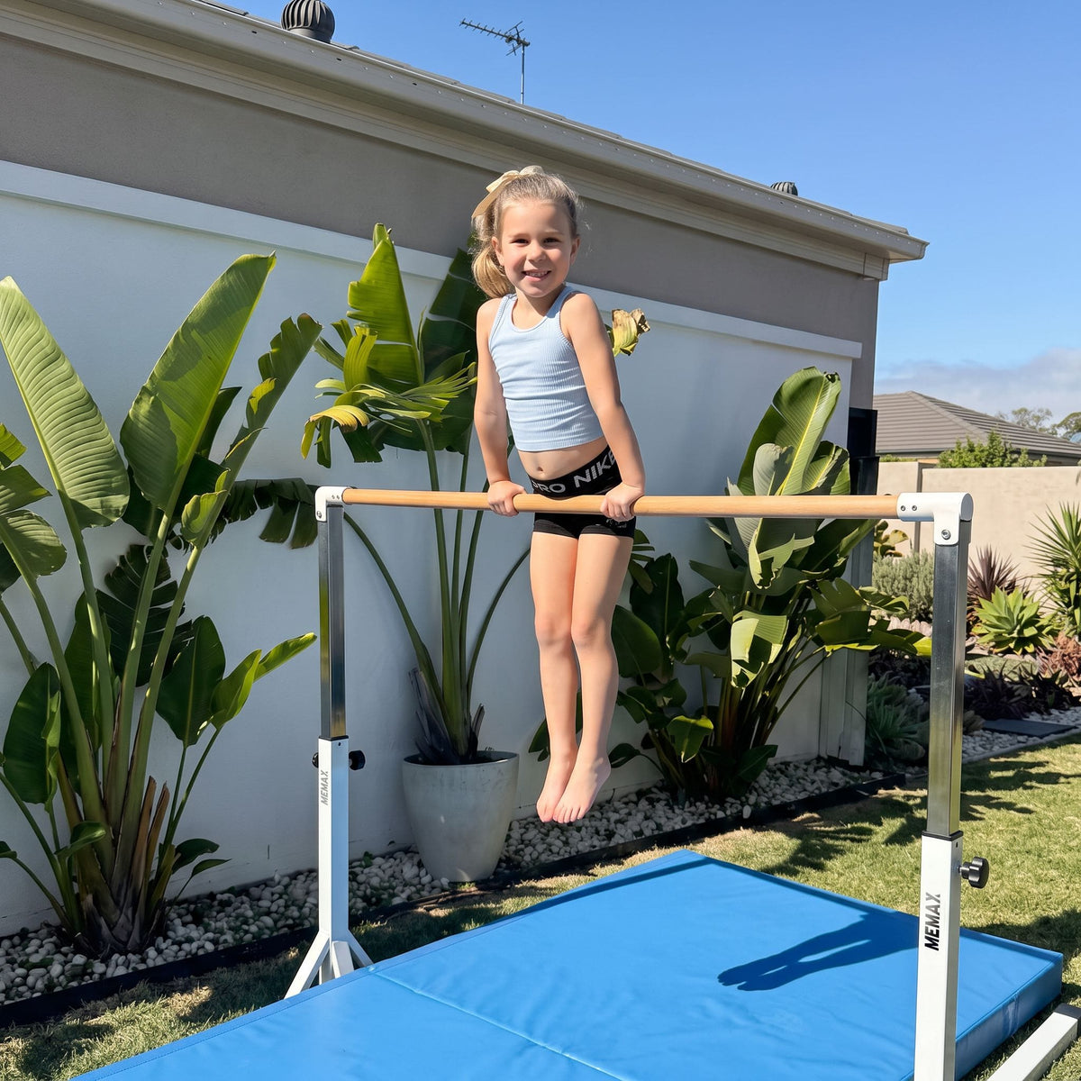 A girl training on the MEMAX Gymnastic Elite High Bar