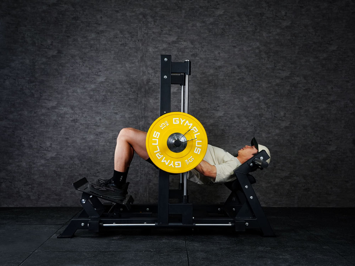 Gym Plus 3D Smith Hip Thrust Machine 3D-HT-01 a man performing hip thrust with yellow bumper plates