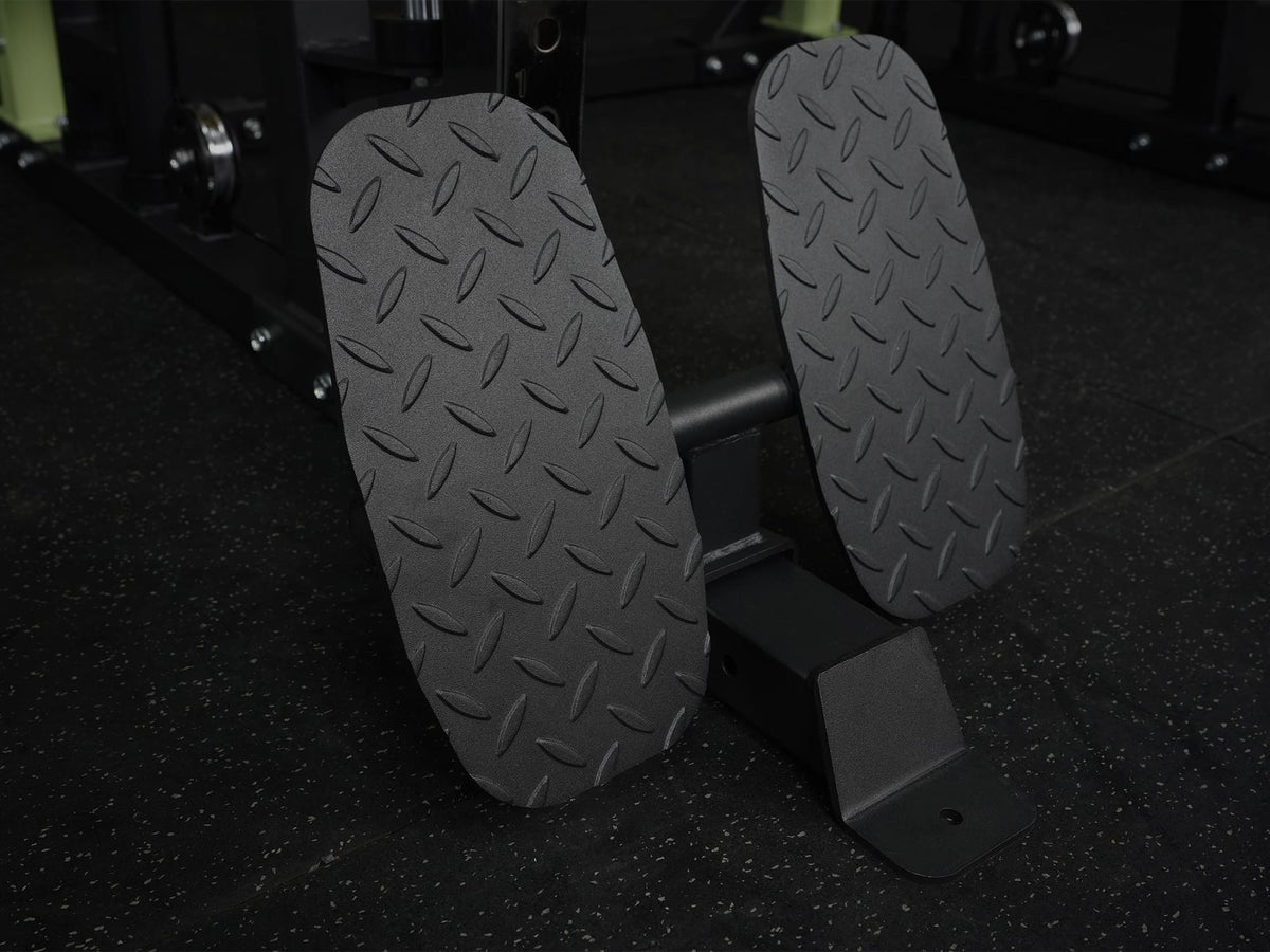 Gym Plus Icon Footrest Attachment FOOTREST-6070 footrest placed on gym flooring