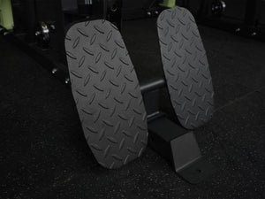 Gym Plus Icon Footrest Attachment FOOTREST-6070 footrest placed on gym flooring