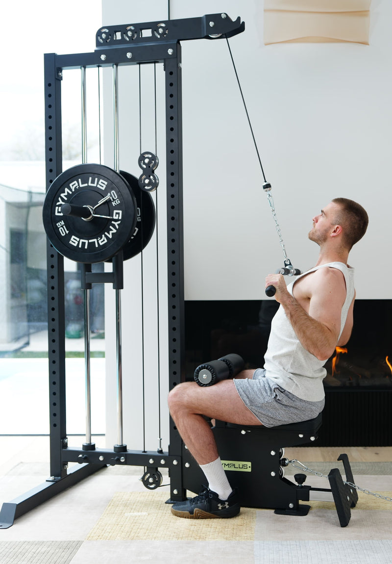 Man using a cable machine in a home gym setting