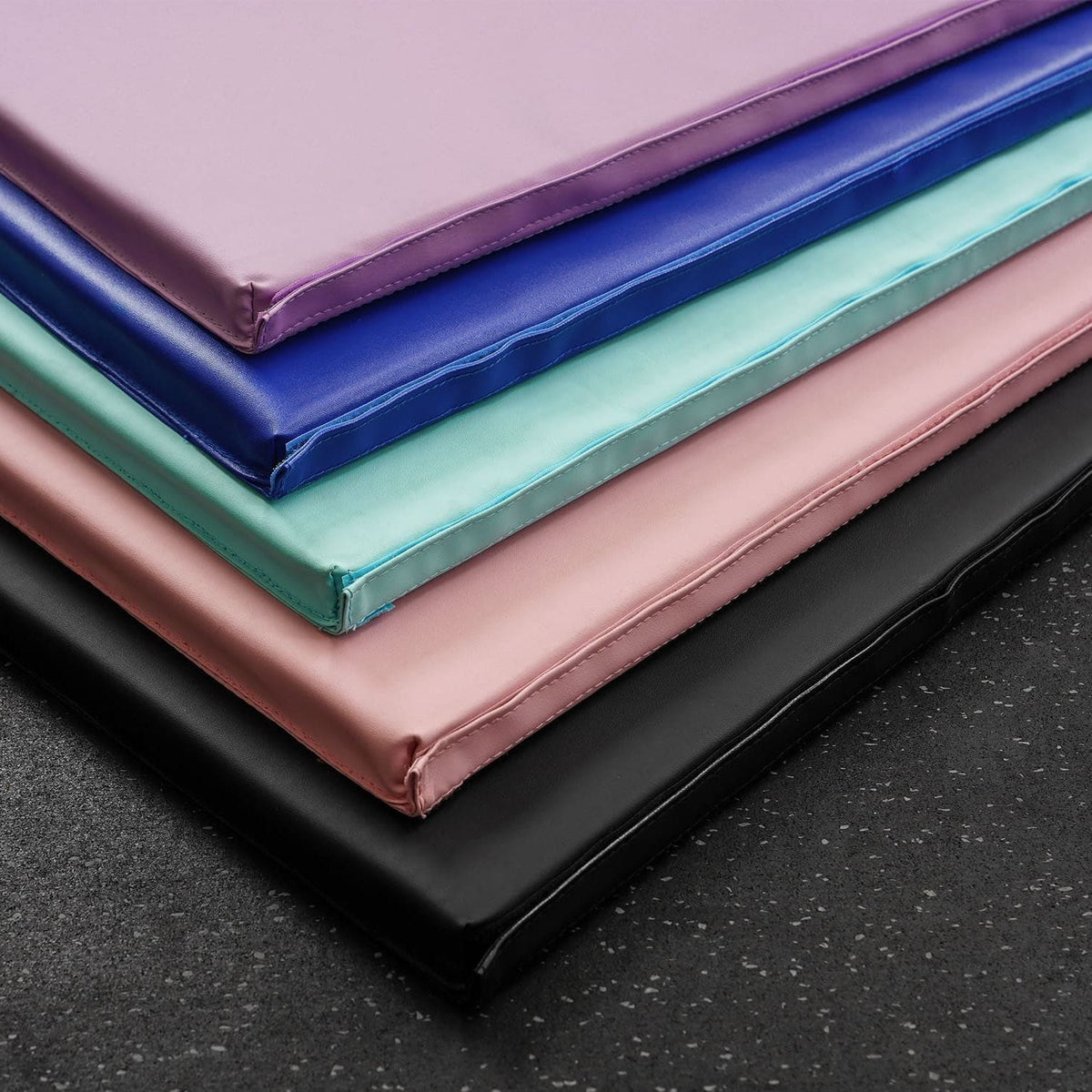 A display of the MEMAX Play Mats in five colour variations